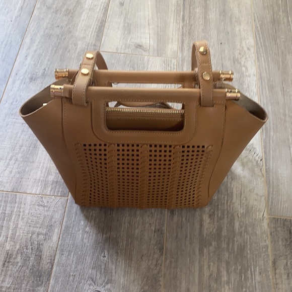 Non brand tan purse with cute detail.  Shows wear inside pocket. - Picture 4 of 5